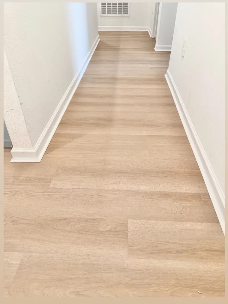 The same Celebration hallway with Balanced Oak luxury vinyl flooring